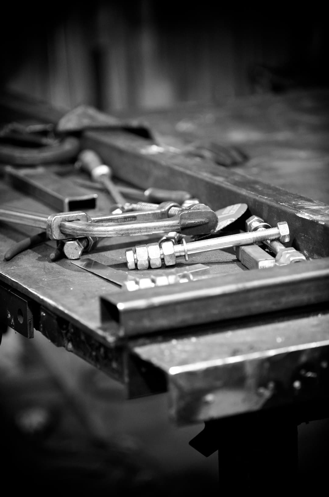 Organized workbench with hand tools including pliers, screwdrivers, and a tape measure